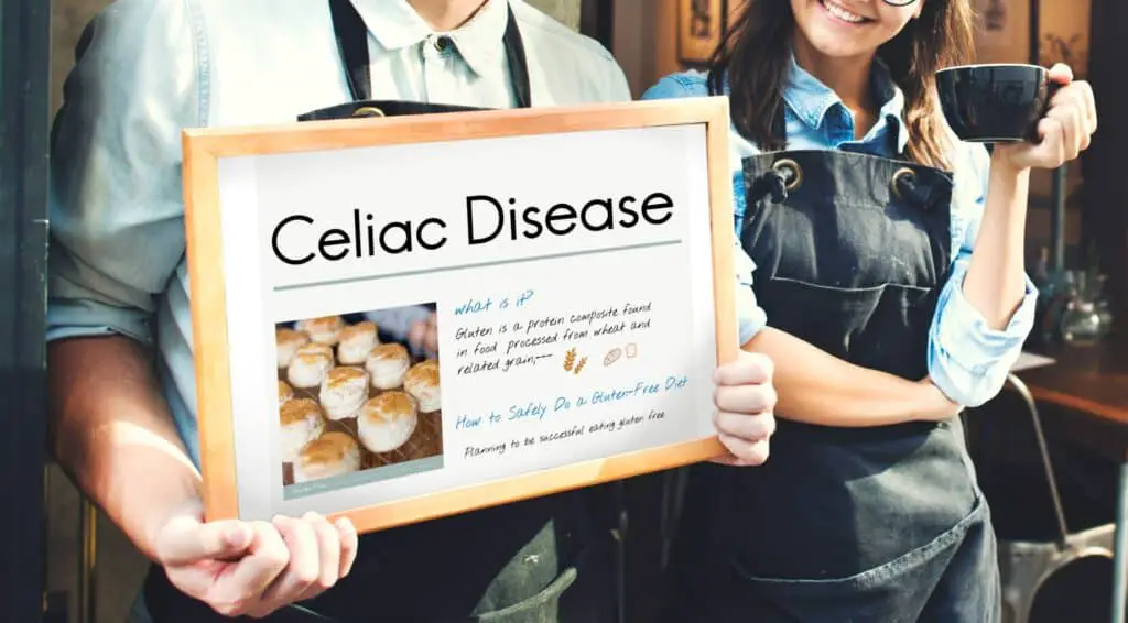 men holding celiac disease information board