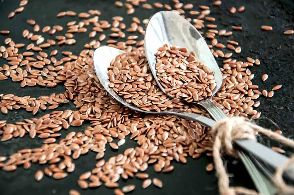Flax seeds in metal spoons