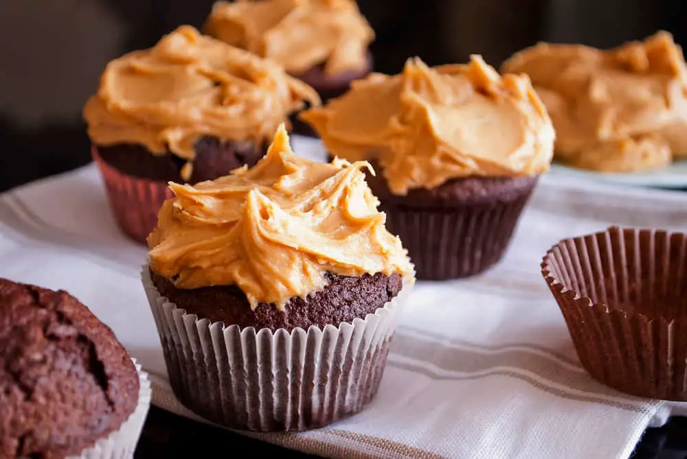 Delicious homemade chocolate muffins topped with peanut butter frosting